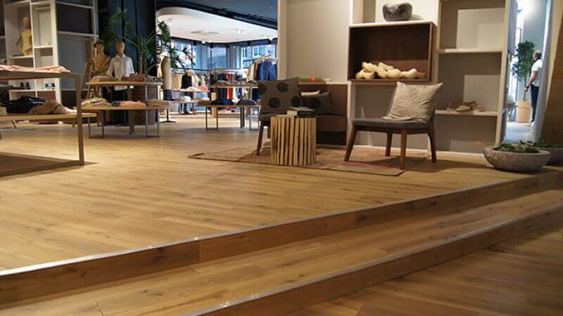 Clothing store with durable hardwood flooring.