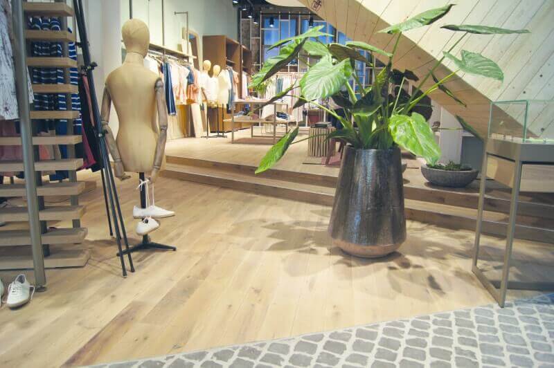 Clothing store with durable hardwood flooring.