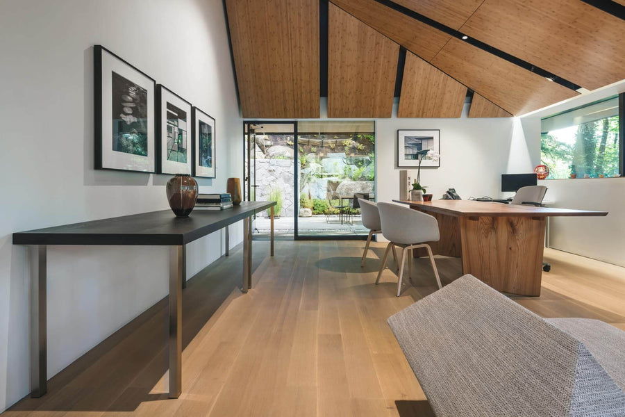 Room in a Japanese Garden home with wide plank hardwood flooring and wood plank in the ceiling.