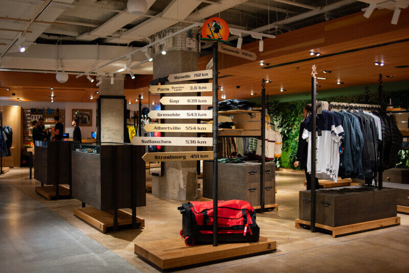 The interior of Eseignol showing clothing display racks with product on them.