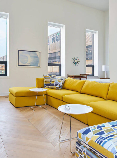 Colorful furniture contrasts with light hardwood floors finished with Rubio Monocoat Oil Plus 2C.