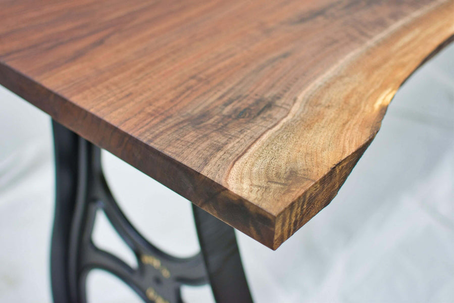 Walnut table with cast aluminum legs finished with Rubio Monocoat Oil Plus 2C.