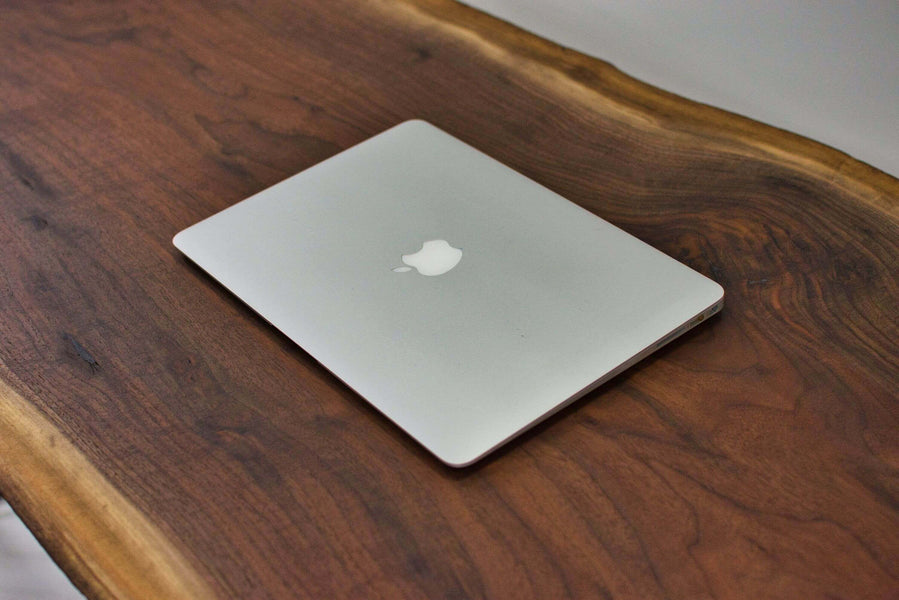 Apple computer on a beautiful walnut desk finished with Rubio Monocoat Oil Plus 2C.