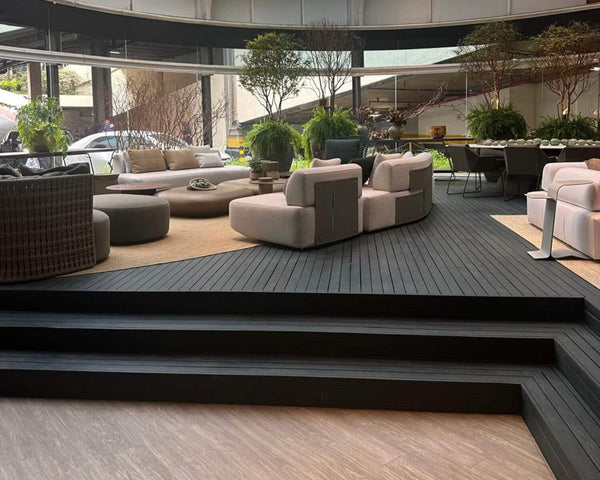 Project inspiration for a dark green wood deck. This deck is a part of a home furnishing store in Brazil. It was crafted from cumaru and finished with DuroGrit exterior wood stain and sealer in one.