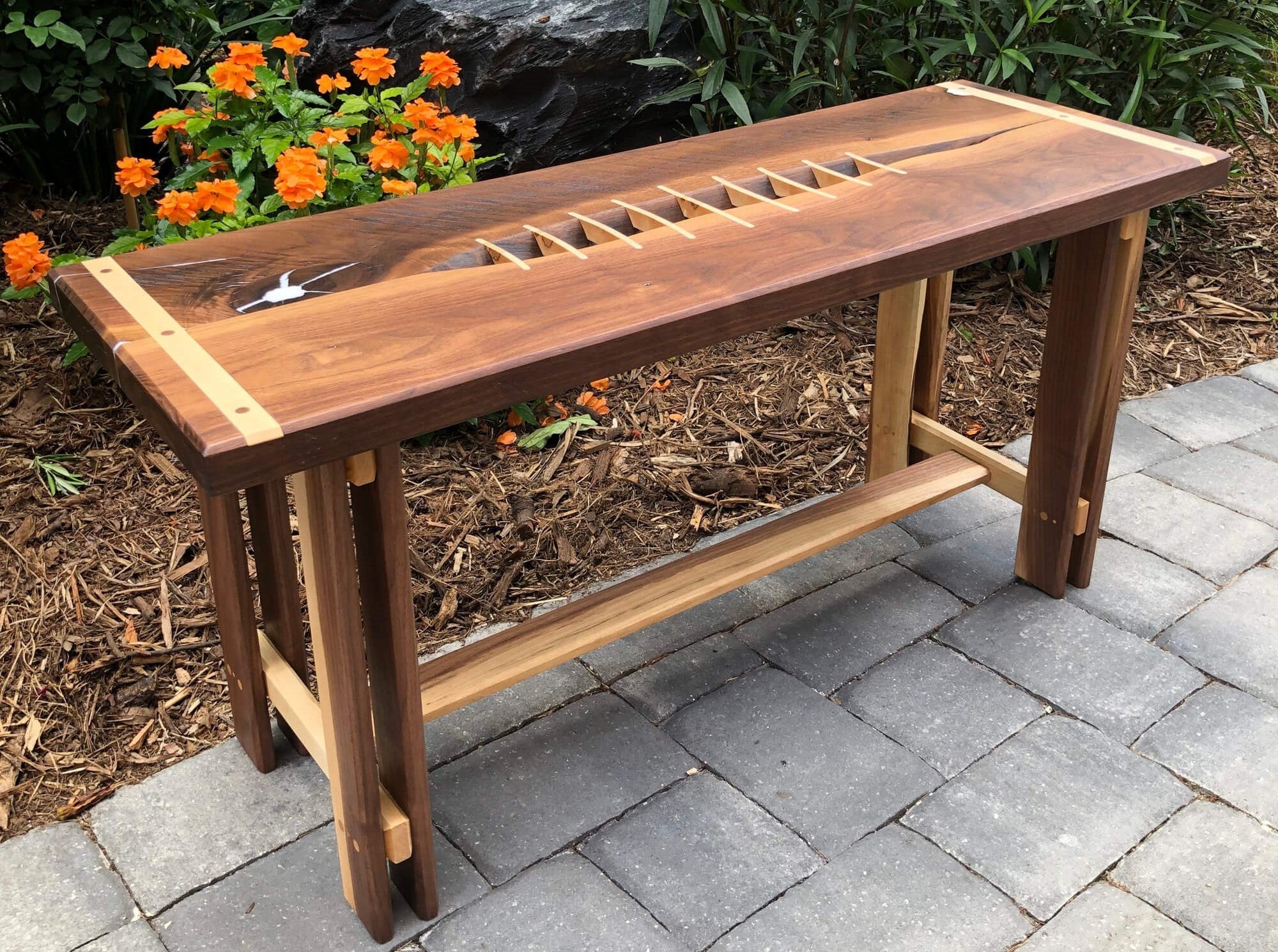 Walnut bench with maple accents finished with Rubio Monocoat hard wax oil wood finish.