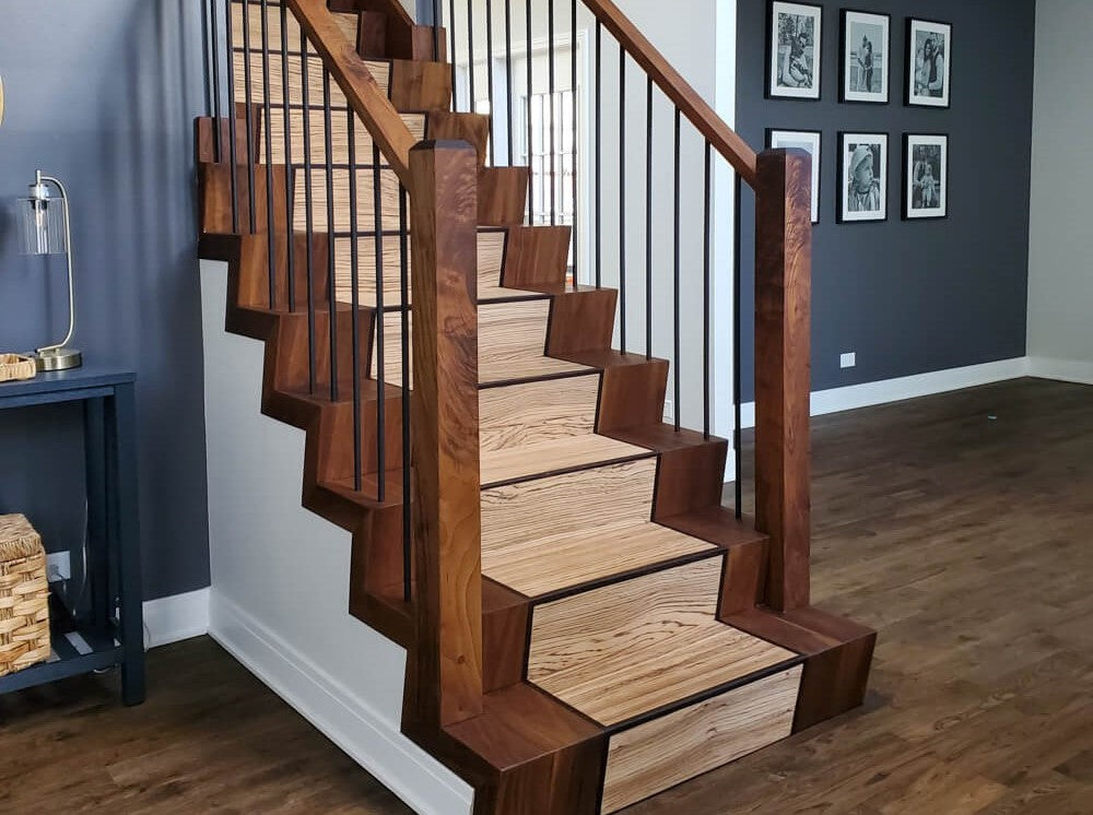 A unique modern staircase crafted from walnut, wenge and zebrawood.
