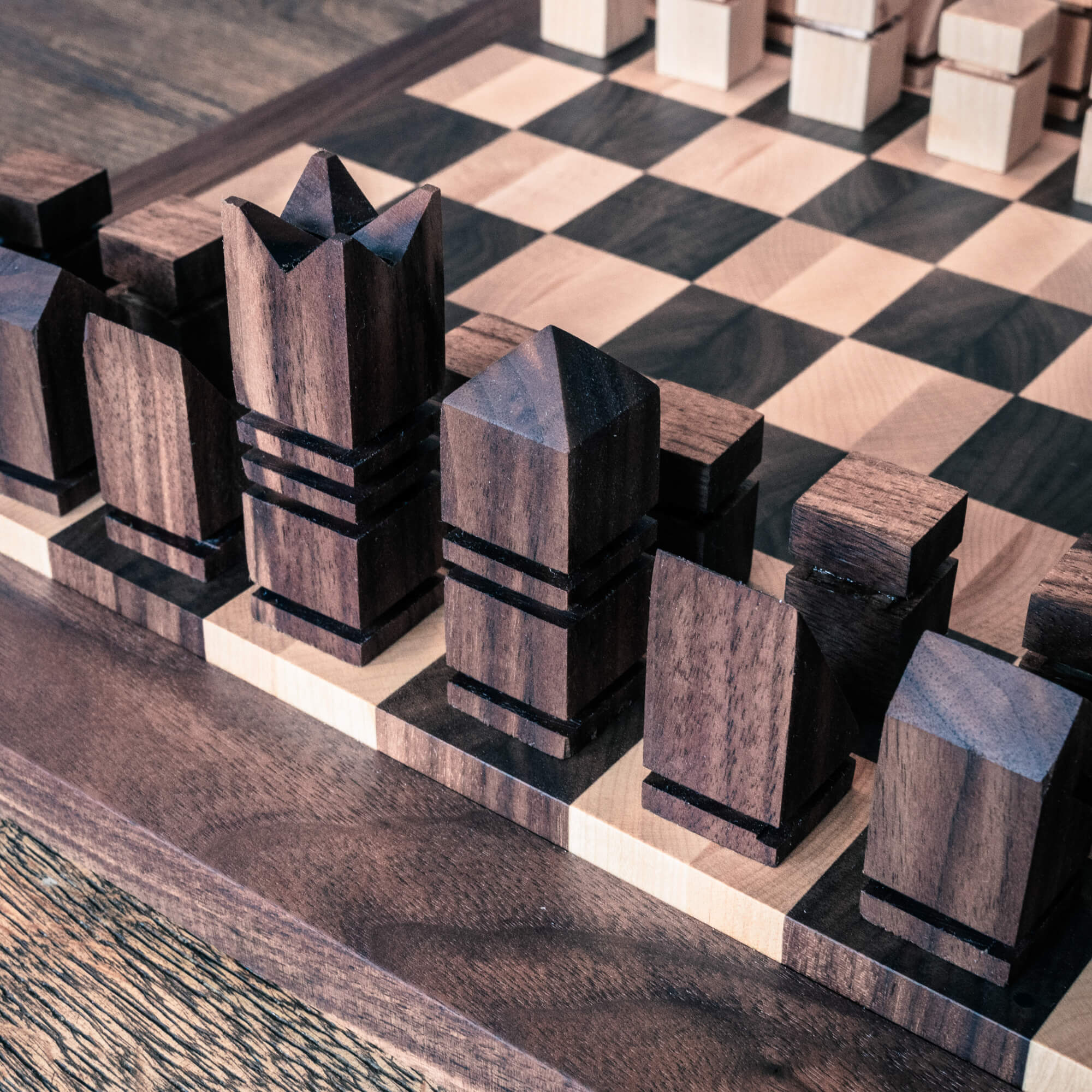 Modern walnut chess pieces finished with Rubio Monocoat hardwax oil wood finish.