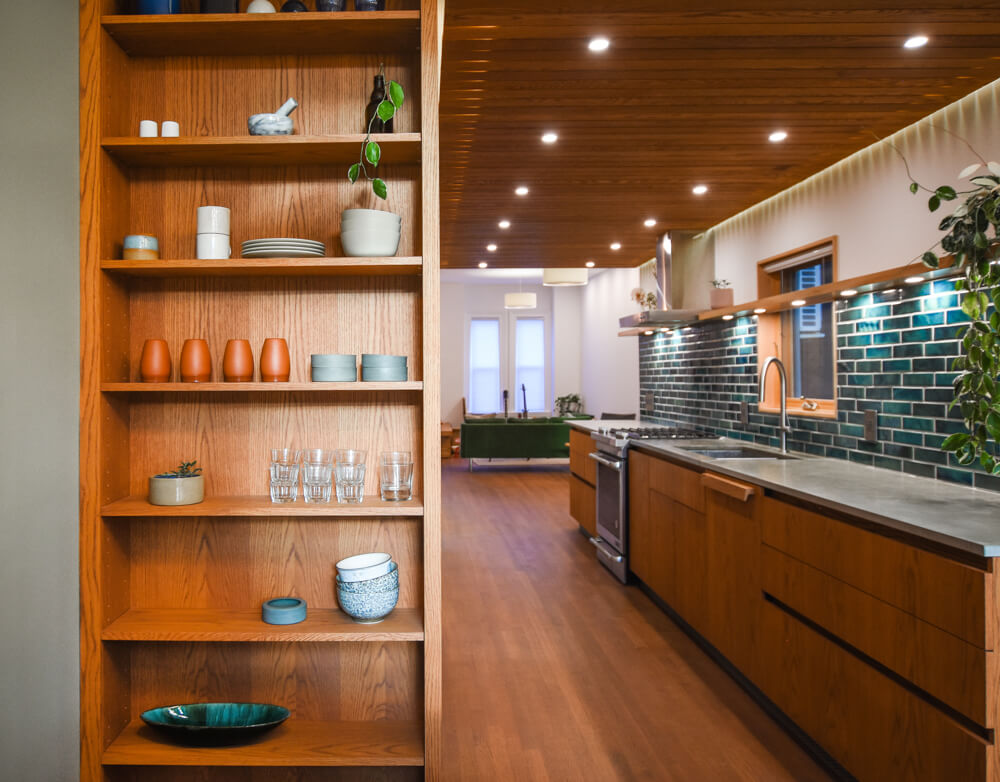 Shelving situated off a galley kitchen made from white oak and finished with Oil Plus 2C in the colour 