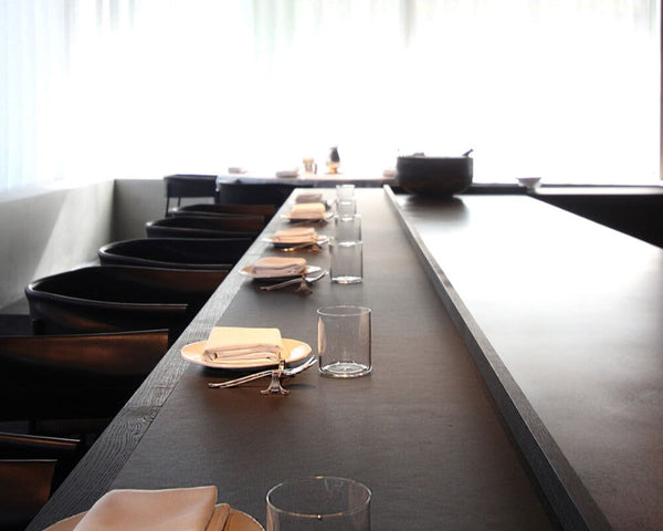 A commercial restaurant with tables finished with Rubio Monocoat products to create a durable, opaque black finish.