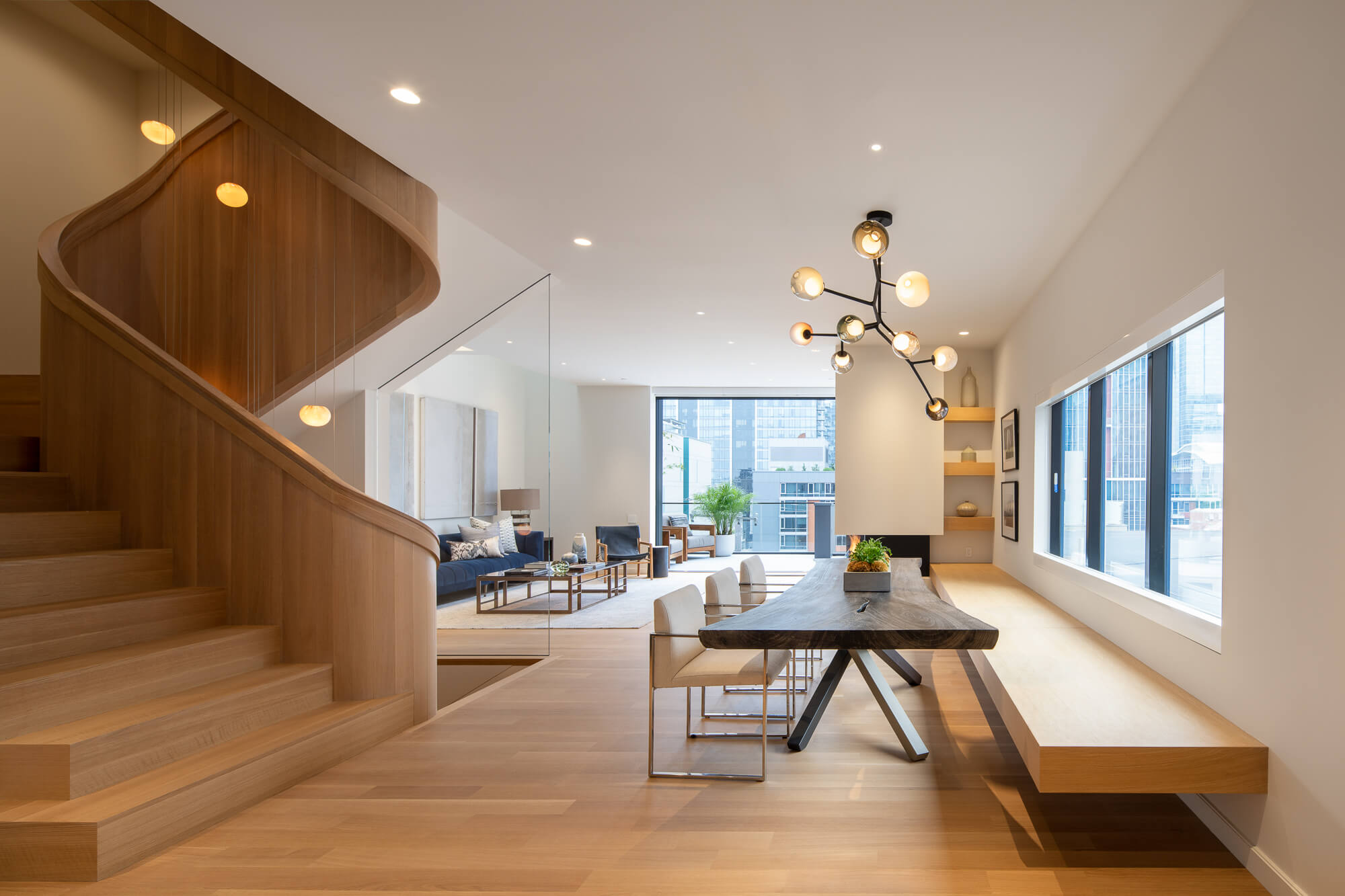 Rift sawn white oak spiraling staircase finished with natural wood finish.