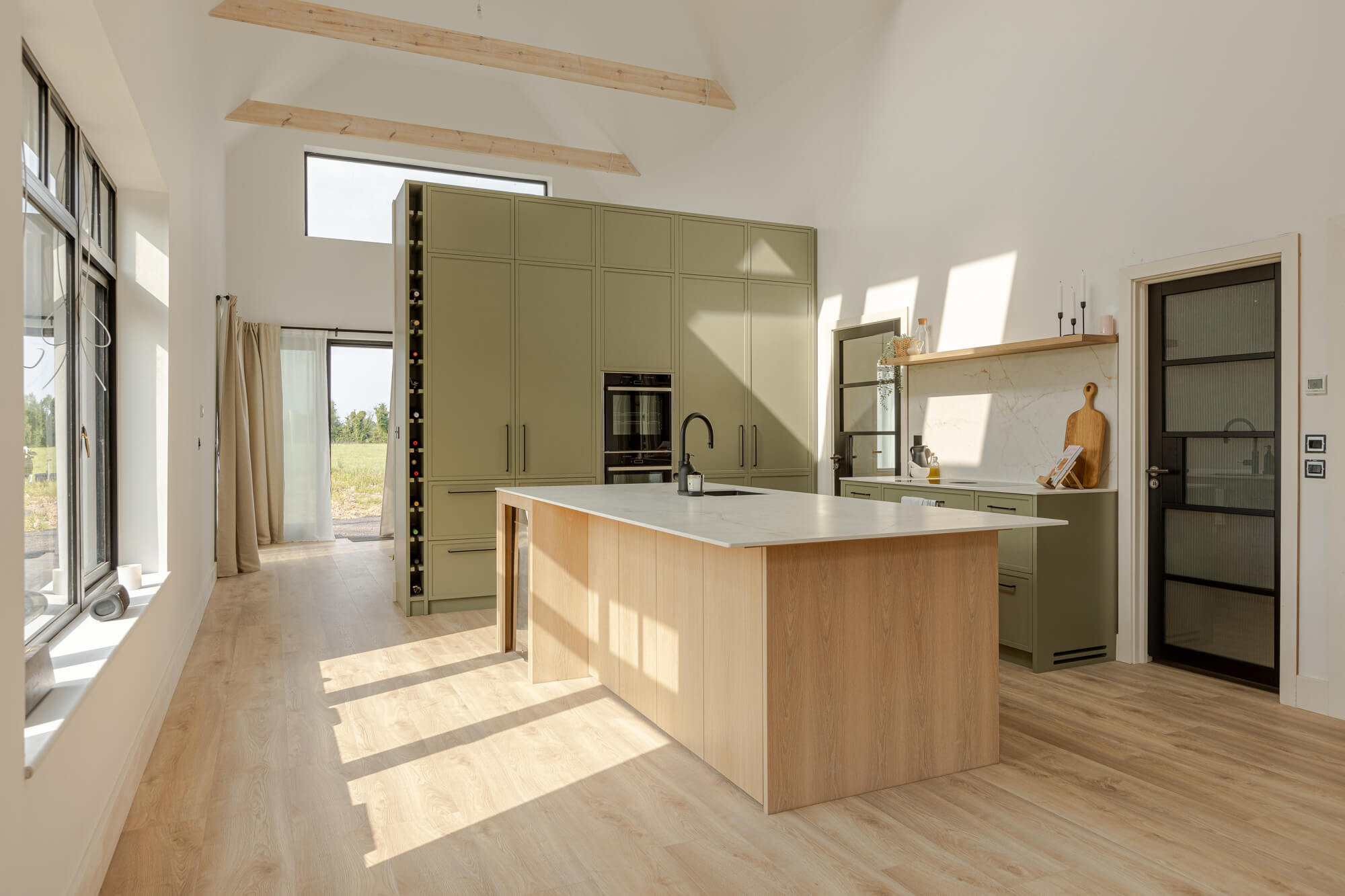 Project inspiration for a modern kitchen with a pop of colour and contrasting wood details. The oak veneer island and floating shelves were finished with Oil Plus 2C 
