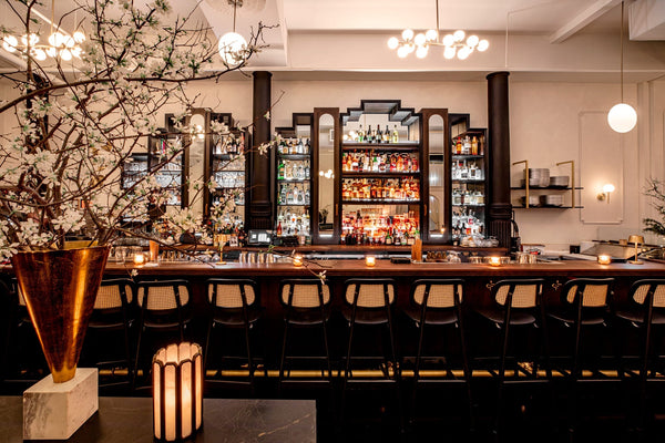 Project inspiration for a restaurant bar top made from walnut and finished with Rubio Monocoat Oil Plus 2C hardwax oil wood stain and finish for interior wood projects.
