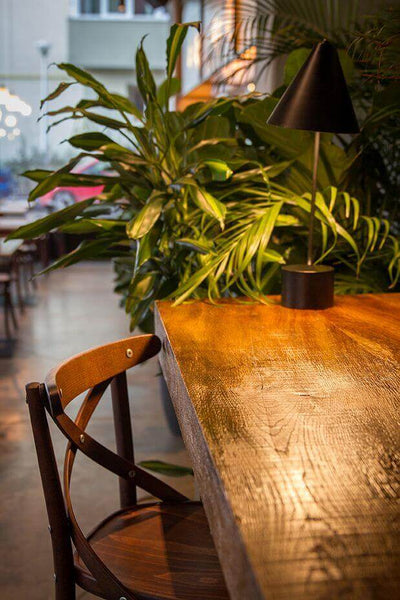Natural looking finish from Rubio Monocoat used to protect and color restaurant tables and chairs.