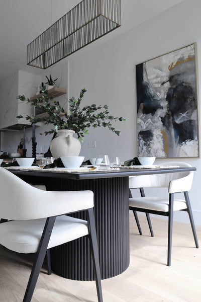One of the two fluted based on a white oak dining table finished with Rubio Monocoat Precolor Easy Intense Black and Oil Plus 2C Black.