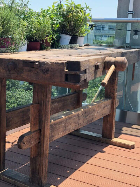 A workbench that was sanded and refinished with natural wood finish.