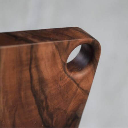 Beautiful details of a wooden serving board finished with a hardwax oil finish.