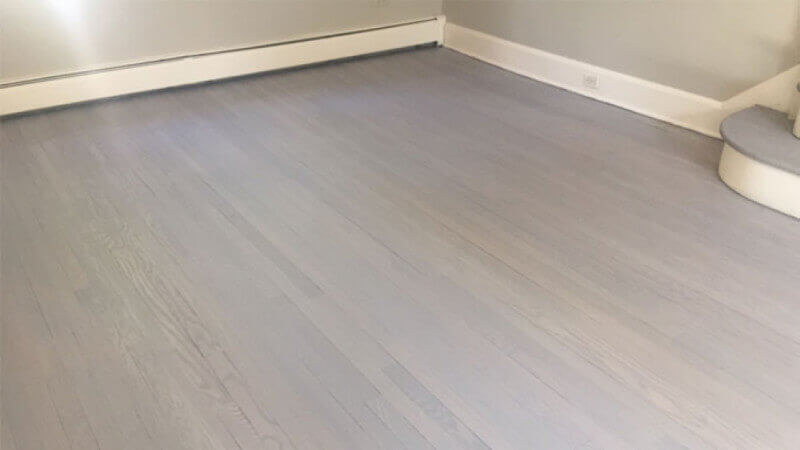 Red Oak hardwood flooring that is finished using Oil Plus 2C Ash Grey.