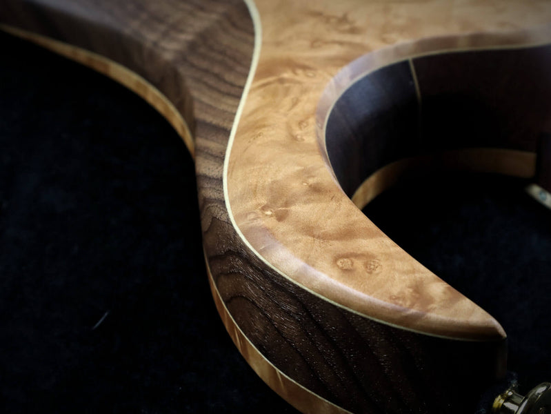 A detail shot of the madrone burl custom guitar.