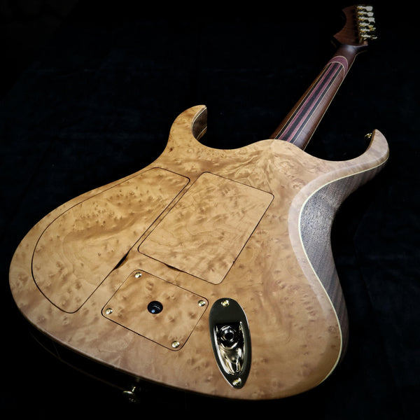An image of the back of the madrone burl guitar.
