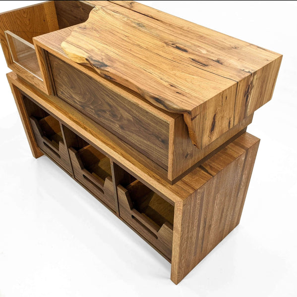 Live edge vinyl storage console made from pecan, walnut and white oak.