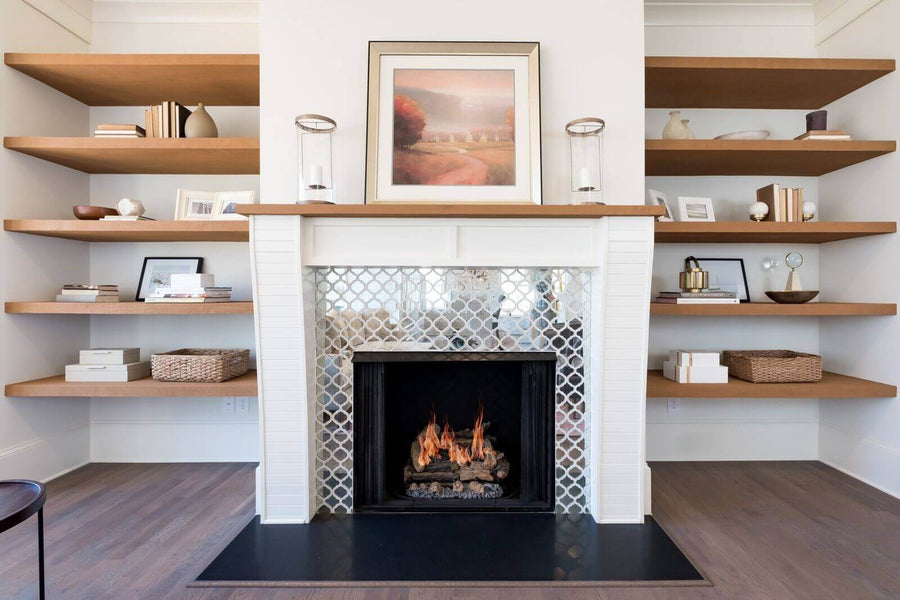 Living room built in shelving around a fireplace and hardwood white oak floors.