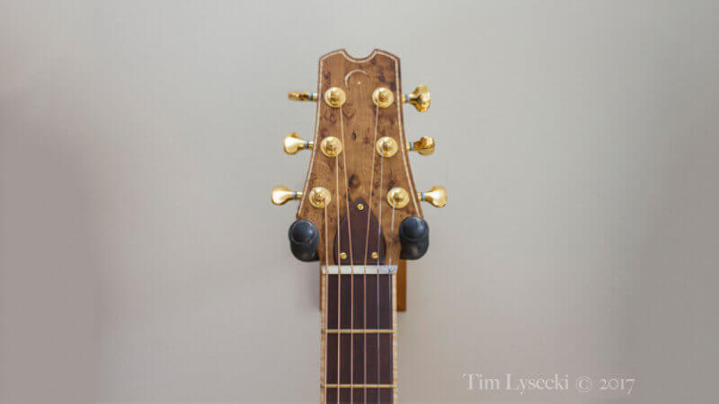 The neck and headstock on an acoustic guitar finished with Rubio Monocoat hardwax oil wood finish.