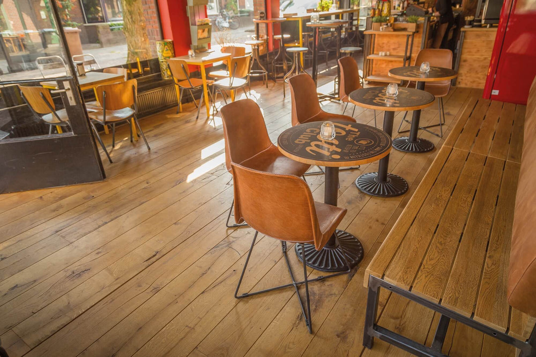 Aged oak flooring in a shop.
