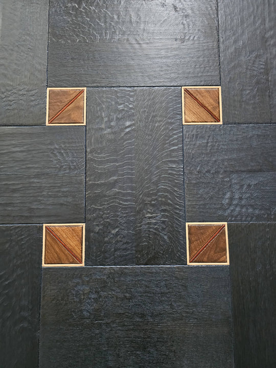 White oak basketweave pattern with small squares made from walnut, bubinga, and maple wood.