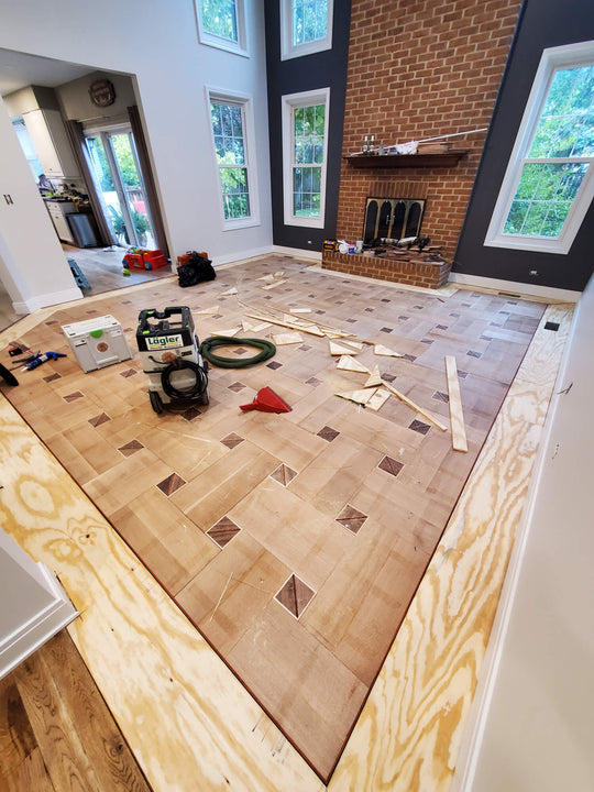 Progress on a custom basketweave hardwood floor.