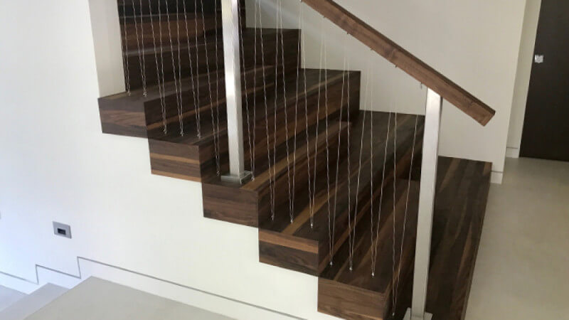 Walnut wooden stairs finished with Oil Plus 2C.