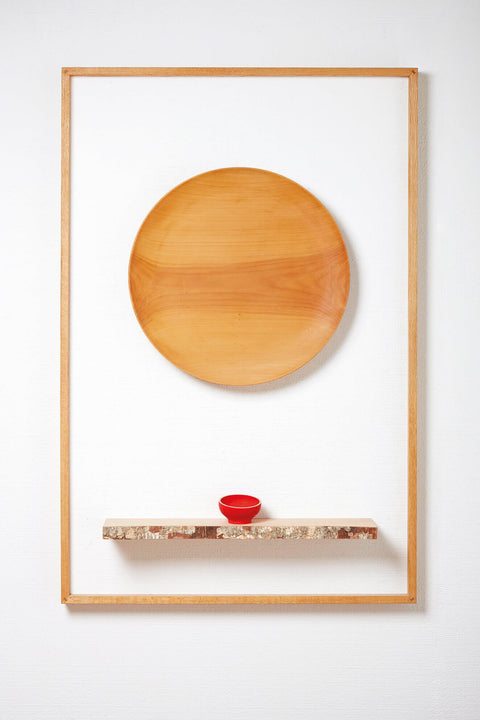 Wooden art hangs on exhibit wall and is finished with Rubio Monocoat wood finish.