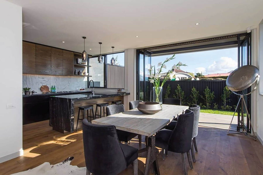 Cozy, warm interior kitchen and dining area with wood flooring.