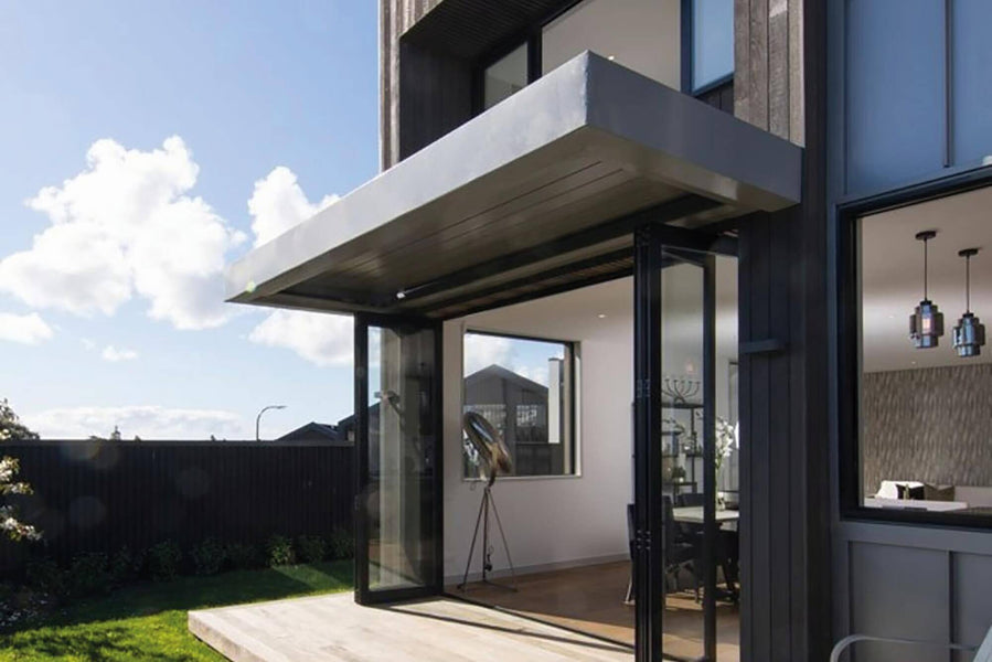 Exterior glass doors opening to small porch.