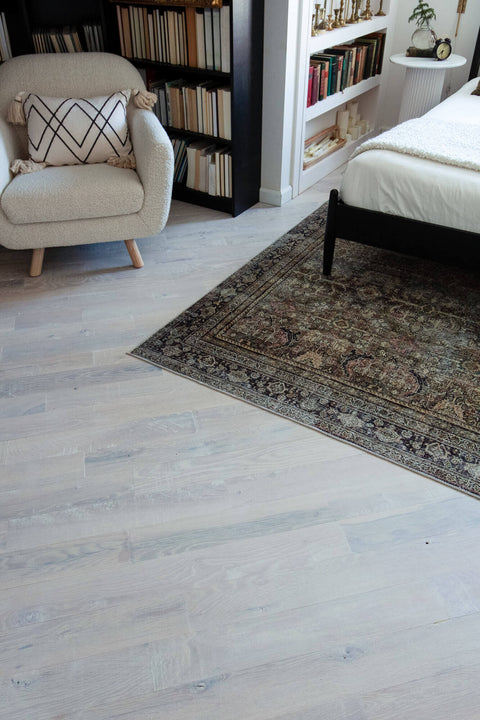 White oak floors stained white and finished with natural wood finish.