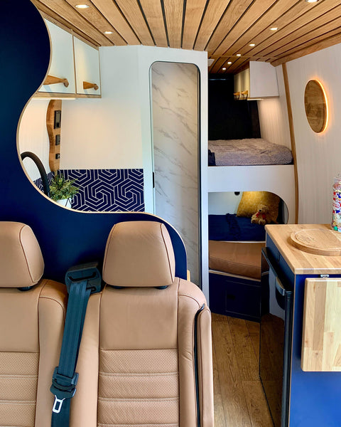 View of the interior of a conversion camper van with oak accents finished with Rubio Monocoat Hybrid Wood Protector.