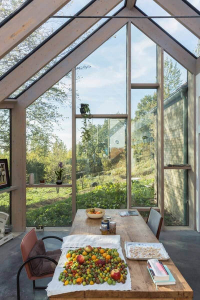 Wood table in glass sun room.