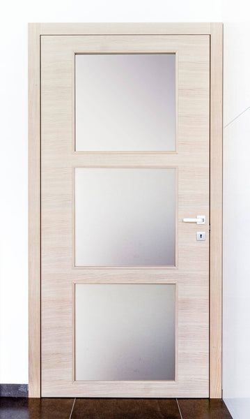 Light wood door with three glass panes.