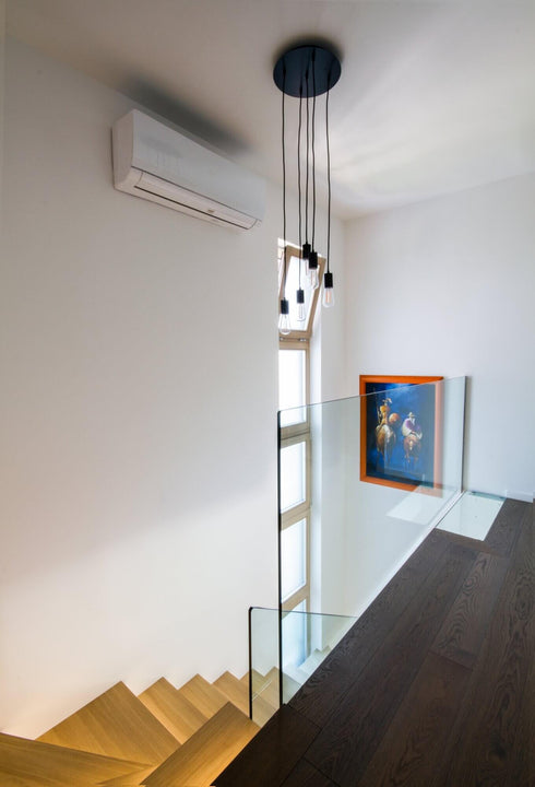 Dark hardwood flooring on the upstairs of a home.