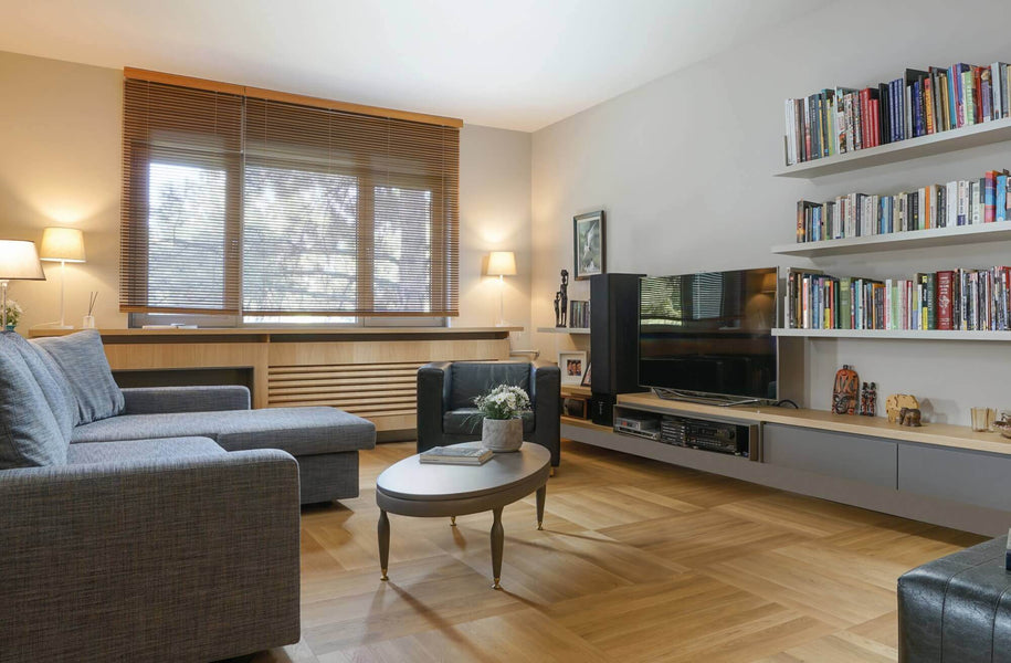 Hardwood parquet flooring in a decorated living room.