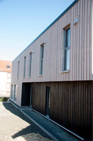 Exterior wood finish on wood paneled building.