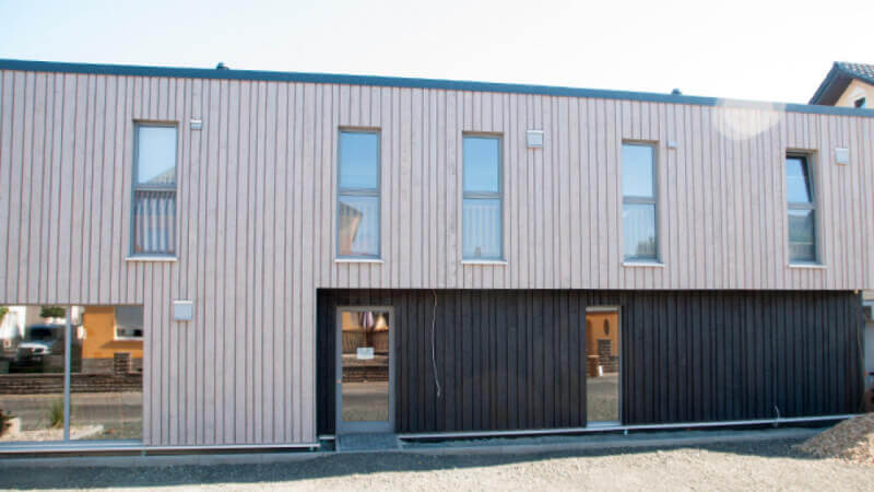 Exterior wood finish on wood paneled building.
