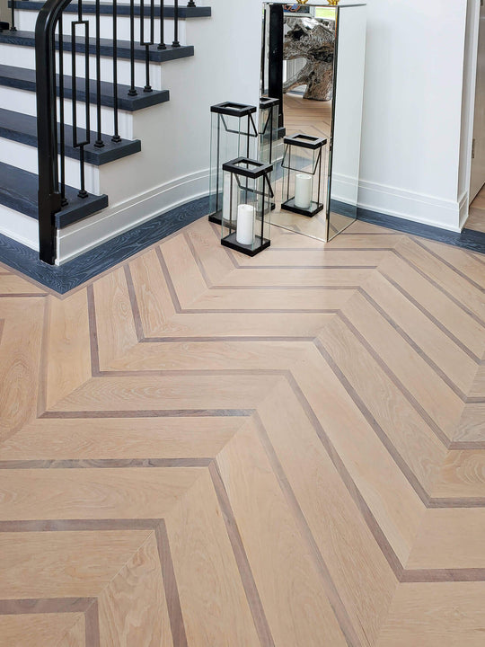 White oak and walnut chevron patterned hardwood flooring.