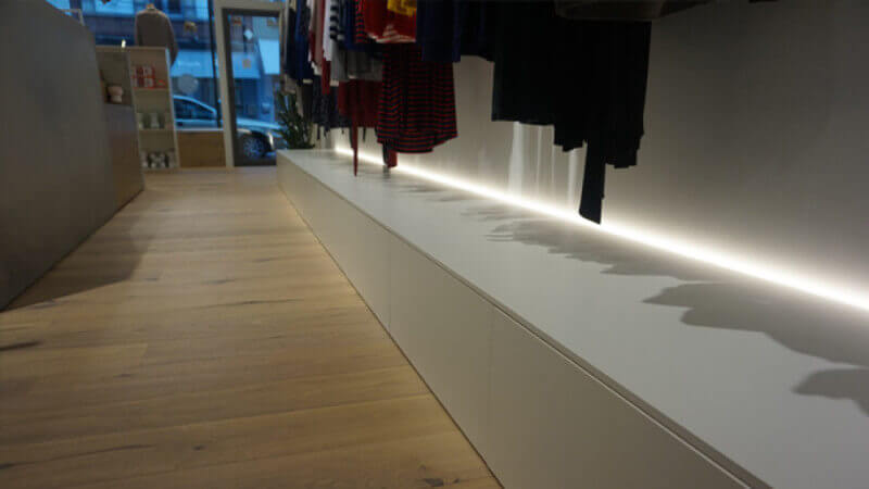 Wooden floors in a clothing store finished with Rubio Monocoat Oil Plus 2C.