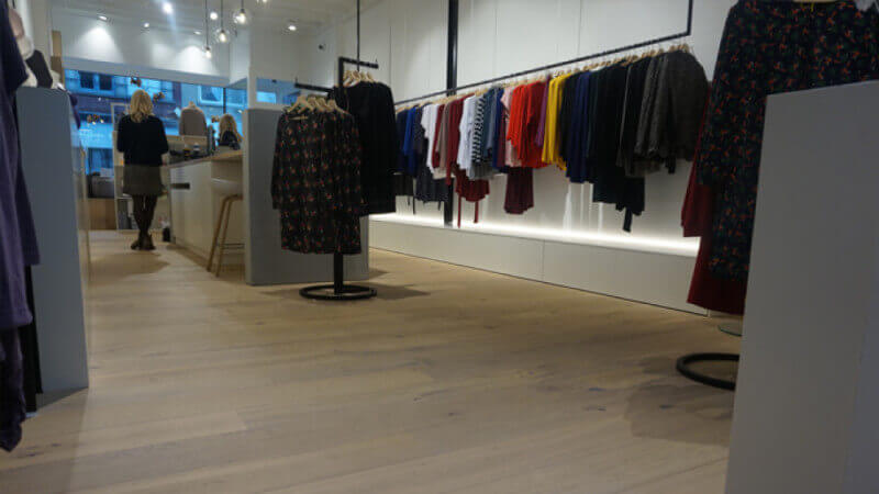 Wooden floors in a clothing store finished with a hardwax oil from Rubio Monocoat.