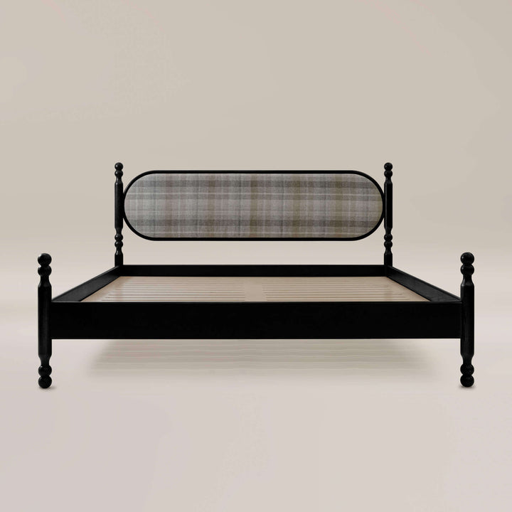 King size wooden bed with upholstered oval shaped headboard.