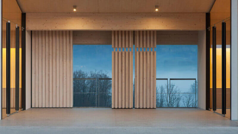 Vertical wooden accent panels used in a building.