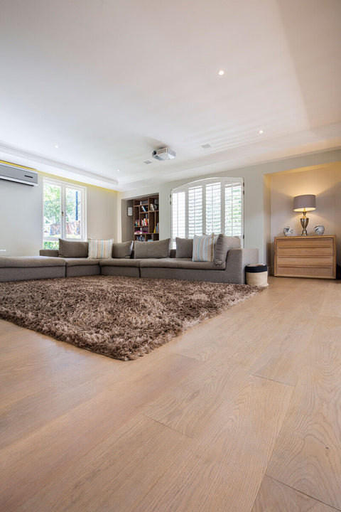 Wide plank hardwood floors in a living room.