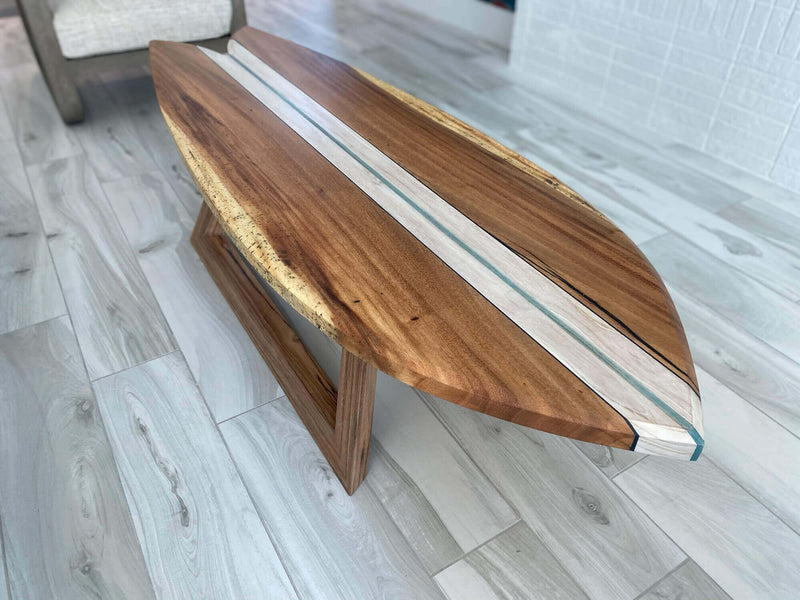 Wood coffee table with a blue piece of teak in the center finished with a hardwax oil wood finish.