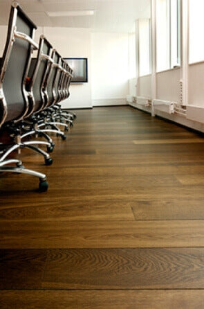 Hardwax oil finished oak wood flooring in a conference room.