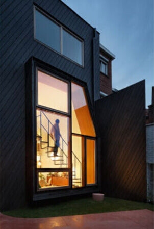 The exterior of a wooden sided house.
